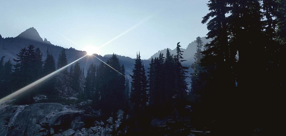 Sun coming up in the Chain Lakes Basin